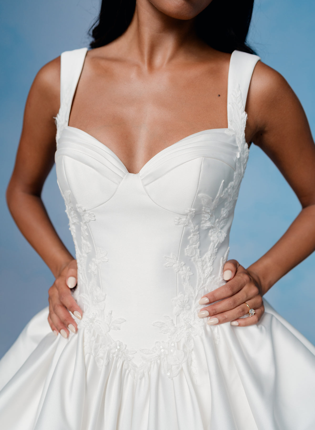 Dramatic, sculpted Mikado gown with lace placement.