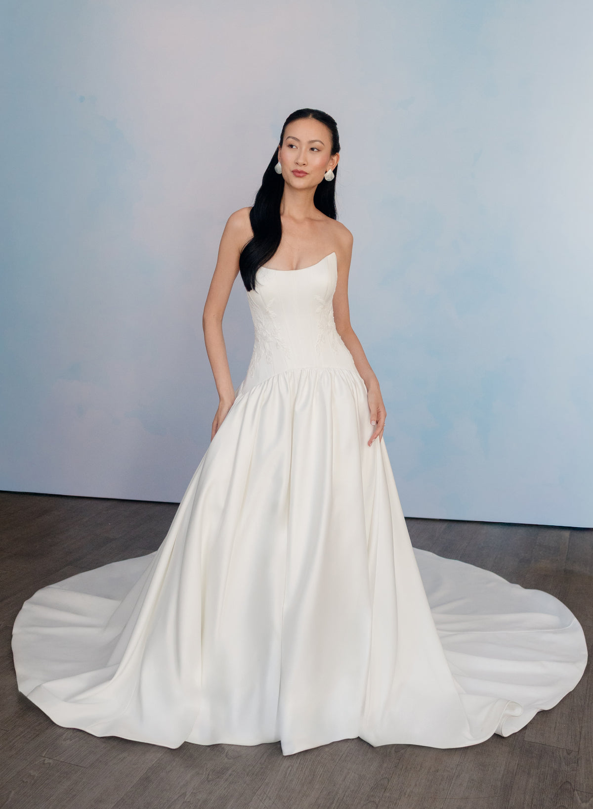 Dramatic drop waist, double face satin ballgown with placed lace and lace up back detail.