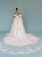 Long veil with lace motifs scattered around the bottom area.