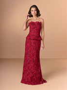Woman wearing a strapless red lace evening gown against a beige background / Created with a truly exquisite lace, this strapless gown features a figure-flattering peplum with a stand-away organically cut neckline.
