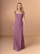 Woman wearing a purple gown with floral details on a beige background / Cap sleeve fitted gown with pleated detail on the bodice and 3D embellishment.