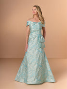 Woman wearing a light blue off-shoulder gown with floral patterns against a beige background / Slim jacquard style with collar/straps twist, pleating on front bodice.