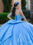 This ball gown features a richly embroidered bodice with off-the-shoulder straps. The full, voluminous skirt is decorated with shimmering floral detailing and flows into an elegant train accented with a bow at the back.