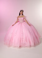 A young woman wearing a voluminous pink ball gown with floral embroidery and a matching pink tiara, posed against a soft pink studio backdrop. / Dreamy off-shoulder ball gown featuring delicate sparkling appliqués, a structured corset bodice, a voluminous tulle skirt, and an oversized statement bow at the back.