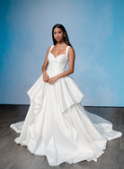 Dramatic, sculpted Mikado gown with lace placement.