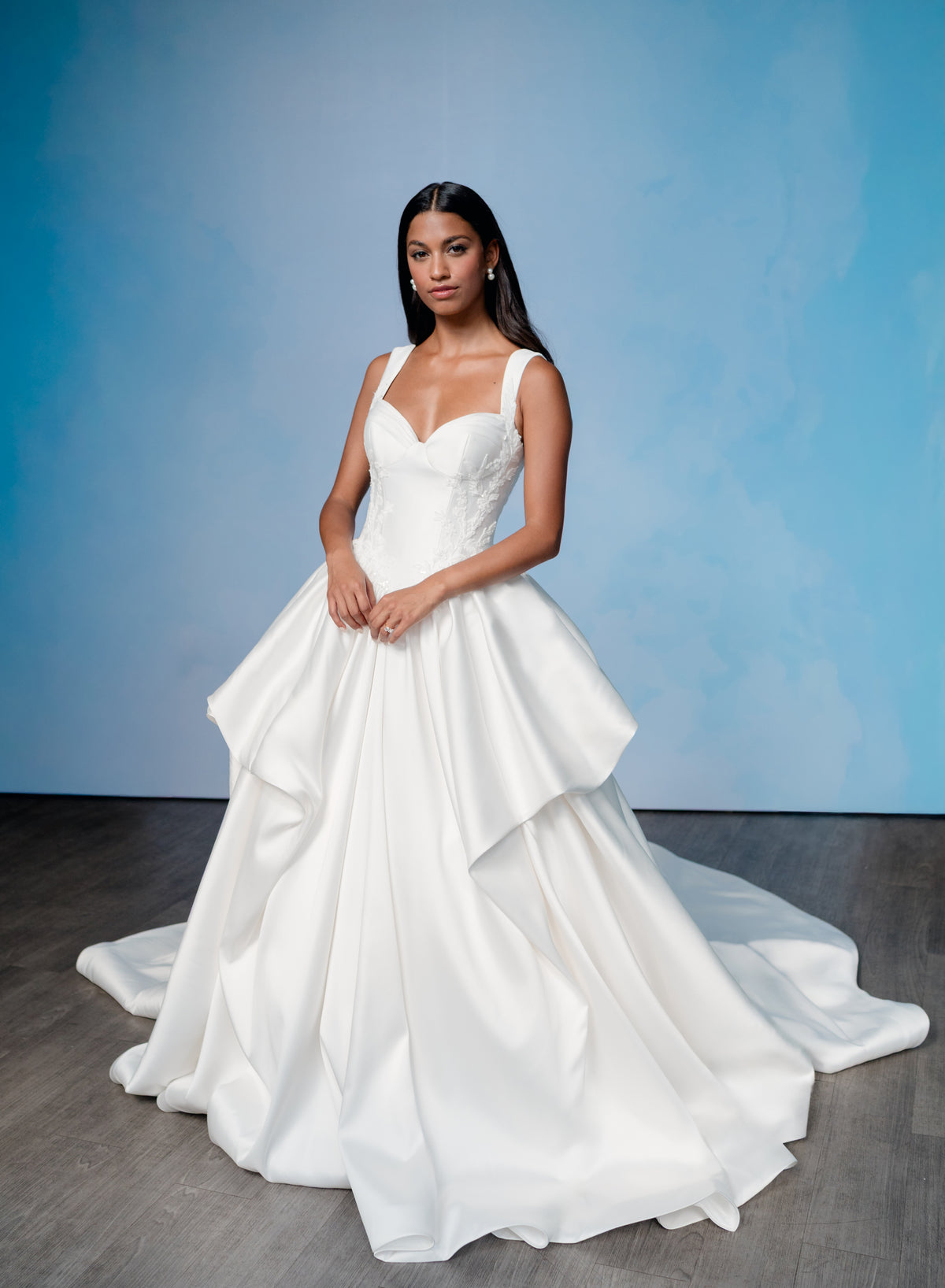 Dramatic, sculpted Mikado gown with lace placement.