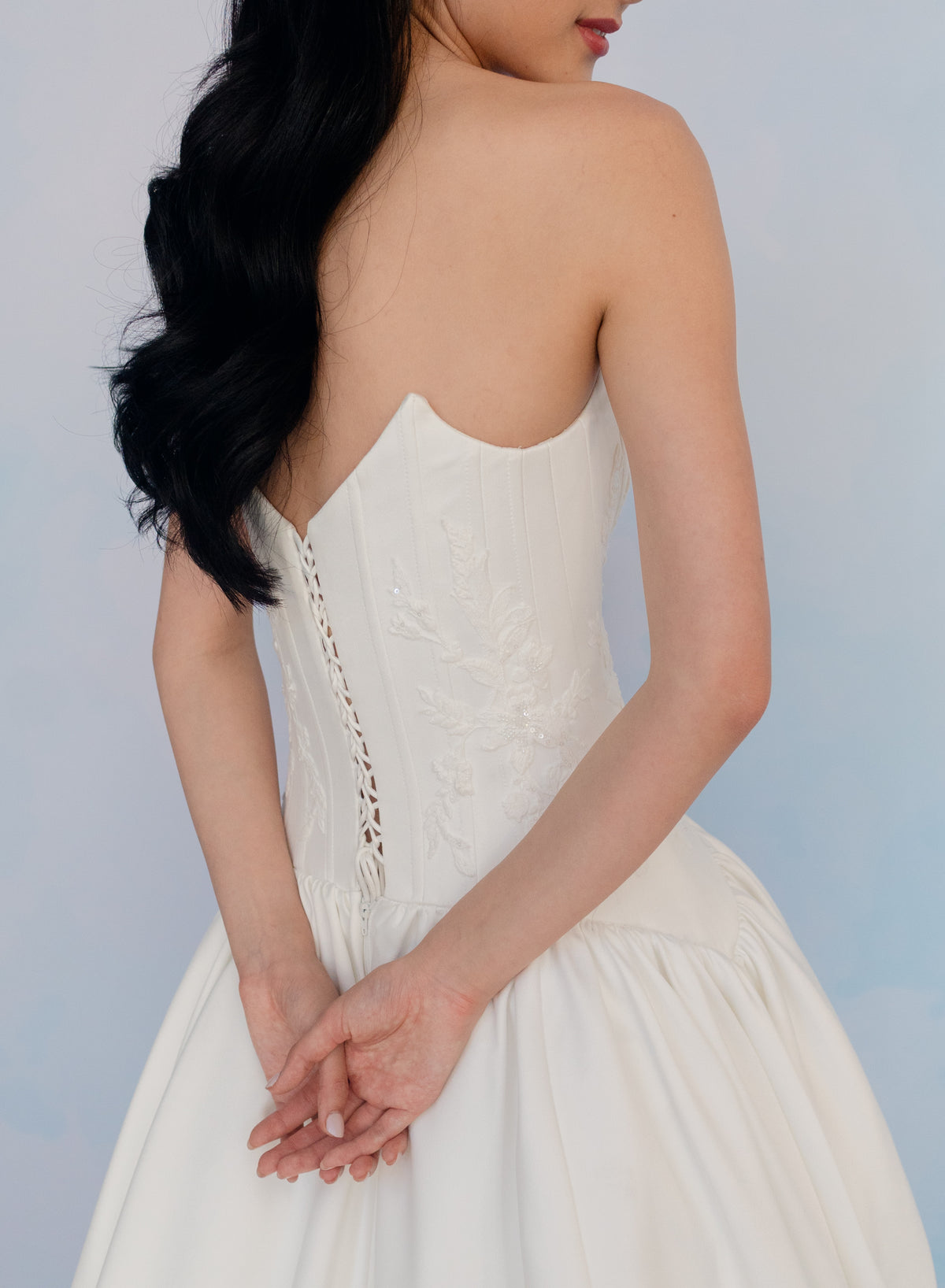 Dramatic drop waist, double face satin ballgown with placed lace and lace up back detail.