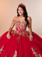 A woman wearing a voluminous red quinceañera ball gown with gold embroidery, a matching red crown, and a red choker against a warm beige studio background. / An off-the-shoulder ball gown featuring an embroidered bodice, a voluminous tulle skirt with floral applique panels, and a large accent bow on the back.